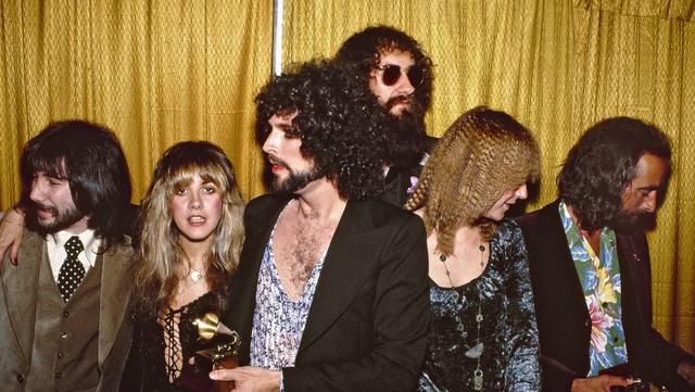 LOS ANGELES - FEBRUARY 23: Rock group Fleetwood Mac wins the Album of the year award at the 20th Grammy awards at the Shrine Auditorium. Left to right producer Richard Dashut, Stevie Nicks, Lindsey Buckingham, Mick Fleetwood, Christine McVie and John McVie on February 23, 1978 in Los Angeles, california. (Photo by Michael Ochs Archives/Getty Images)