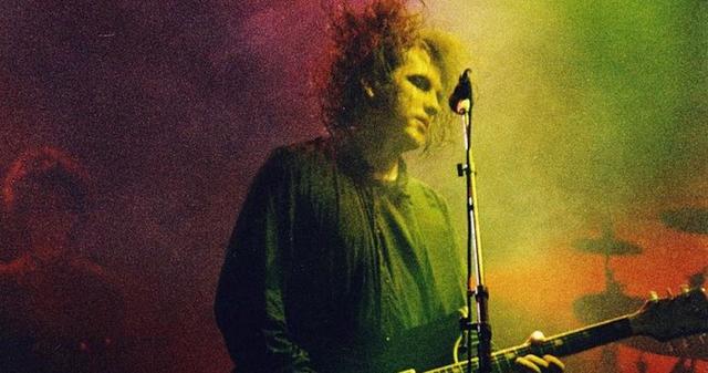 LONDON, UNITED KINGDOM - JULY 23: Robert Smith of The Cure performs on stage at Wembley Arena, on July 23rd, 1989 in London, United Kingdom. (Photo by Pete Still/Redferns)