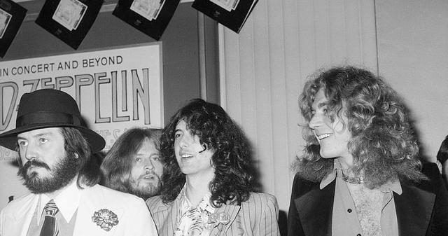 British popular musicians (left to right), drummer John Bonham (1947 - 1980), bassist and keyboardist John Paul Jones, guitarist Jimmy Page, and singer Robert Plant of the rock group Led Zeppelin appear at the West Coast premiere for their concert film 'The Song Remains the Same,' Hollywood, October 21, 1976. The film premiered in New York the night before. (Photo by Frank Edwards/Fotos international/Getty Images)