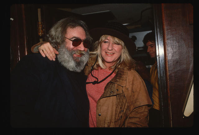Jerry Garcia, singer of The Grateful Dead, and Christine McVie of Fleetwood Mac hugging. (Photo by LGI Stock/Corbis/VCG via Getty Images)