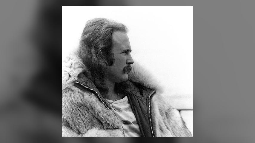 BIG SUR, CA - SEPTEMBER 14-15: Singer David Crosby of Crosby, Stills and Nash looks on in a fur coat during the Big Sur Folk Festival at the Esalen Institue on September 14-15, 1969 in Big Sur, California. (Photo by Robert Altman/Michael Ochs Archives/Getty Images)