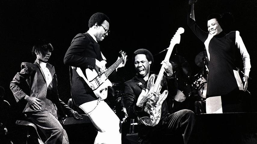 Chic perform on stage in London, October 1979. Left to right: Luci Martin, Bernard Edwards, Nile Rodgers and Alfa Anderson. (Photo by Gus Stewart/Redferns)
