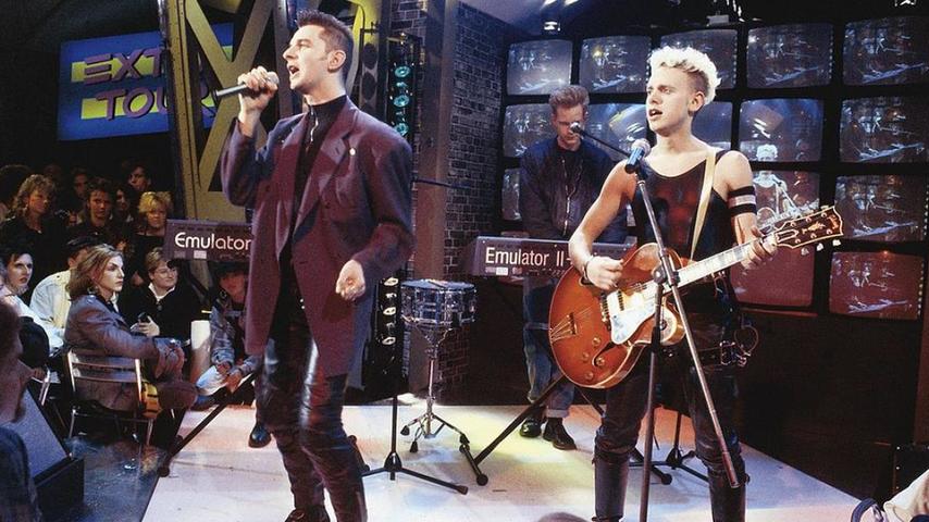 GERMANY - 1st JANUARY: Dave Gahan and Martin Gore (right) from Depeche Mode perform live on a TV show in Germany in 1987. Emulator II keyboard being played behind. (Photo by Martina Raddatz/Redferns)