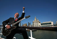 LIVERPOOL, ENGLAND - APRIL 20: Liverpool musician and singer Gerry Marsden sings as he receives the freedom of the city on board the Mersey ferry which he made famous with his song Ferry Across The Mersey on April 20, 2009 in Liverpool, England. Gerry's freedom of the city is in honour of his charitable services to the city and his contribution to Liverpool life. His other hits as part of the band Gerry And The Pacemakers, included You'll Never Walk Alone and I Like It. (Photo by Christopher Furlong/Getty I